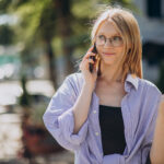 Woman travelling, and using phone