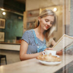 Closeup portrait of сafe city lifestyle woman sitting in trendy